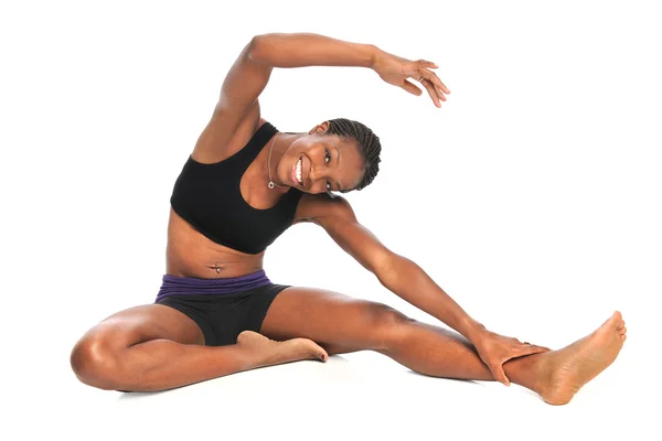 Afroamerikanska kvinna stretching — Stockfoto