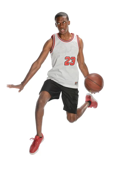 Basket spelaren dunking bollen — Stockfoto