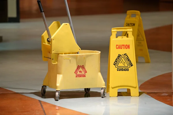 Mop, Bucket and Caution Wet Floor Stock Photo - Image of spanish