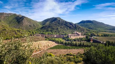 View of the religious monastery of Porta Coeli in the heart of the Calderona mountain range of Valencia. clipart