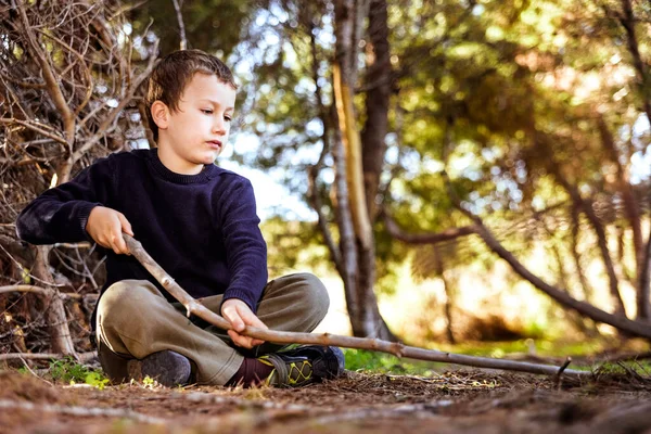 Child Sitting Ground Forest Uses Stick Draw Ground Experience Nature Royalty Free Stock Images