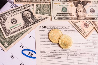 Bitcoin sikkeleri kriptoya büyük yatırımları yansıtır ve Form 1040 'ta vergi ödedikleri rapor edilir..