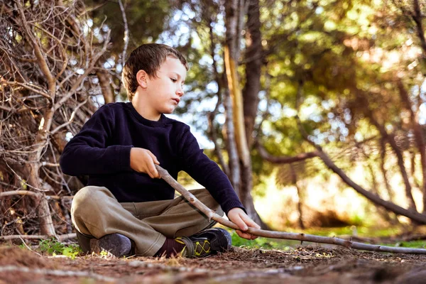 Child Sitting Ground Forest Uses Stick Draw Ground Experience Nature Stock Picture