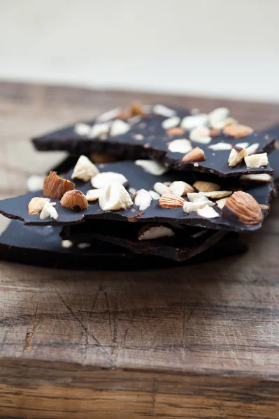 Raw vegan chocolate with nuts — Stock Photo, Image