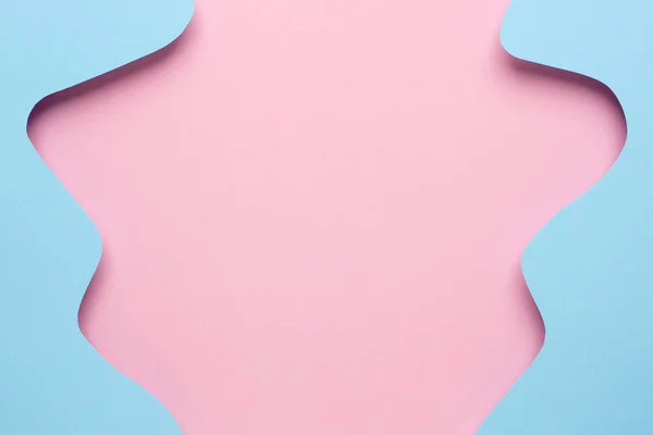 Soyut kağıt, pembe arkaplanda mavi dalga sanatı, pastel renkler üst görünümde