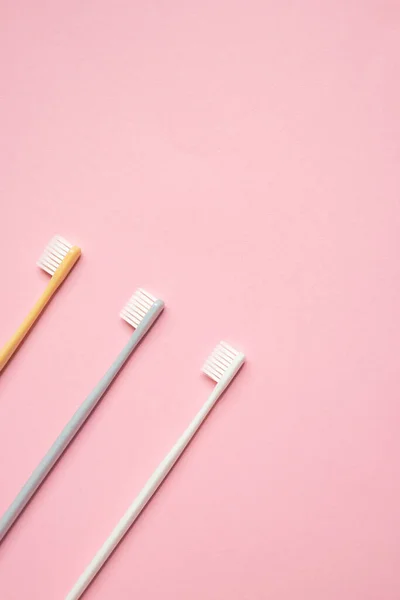 Gray White Toothbrushes Pink Background Taking Care Teeth Dental Concept — Stock Photo, Image