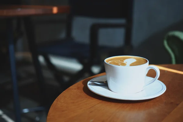 Cup of coffee in coffee shop — Stock Photo, Image