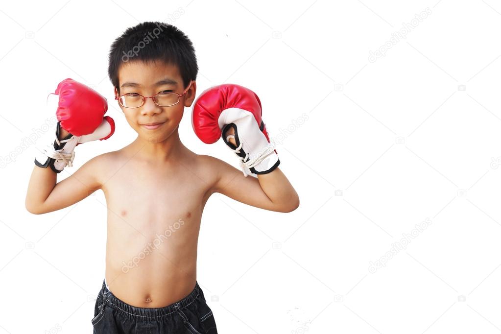 portrait of happy young kid with boxing glove 