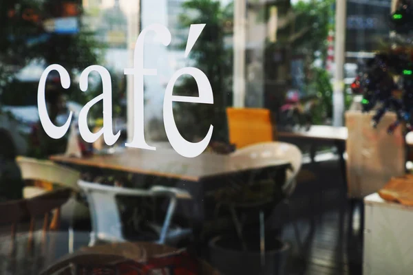 Text cafe in front of mirror coffee shop — Stock Photo, Image