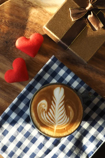 Vintage color tone of  cup of coffee with red heart on the table — Stock Photo, Image