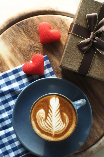 Vintage color tone of  cup of coffee with red heart on the table — Stock Photo, Image