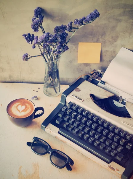 Vintage typewriter on the wood texture — Stock Photo, Image