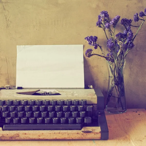 Vintage typewriter on the wood texture — Stock Photo, Image