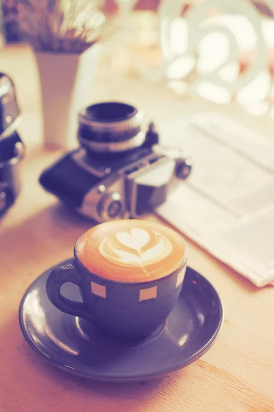 Cup of Coffee in coffee shop vintage color tone style — Stock Photo, Image