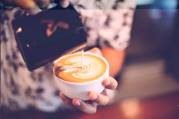 Cup of coffee latte on the wood texture — Stock Photo, Image