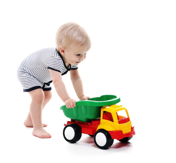 Baby boy play toy truck — Stock Photo, Image