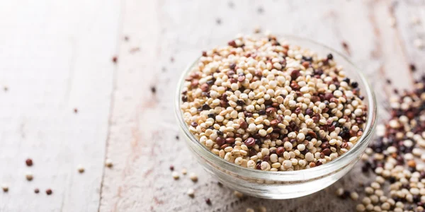 Pile of mixed raw quinoa — Stock Photo, Image