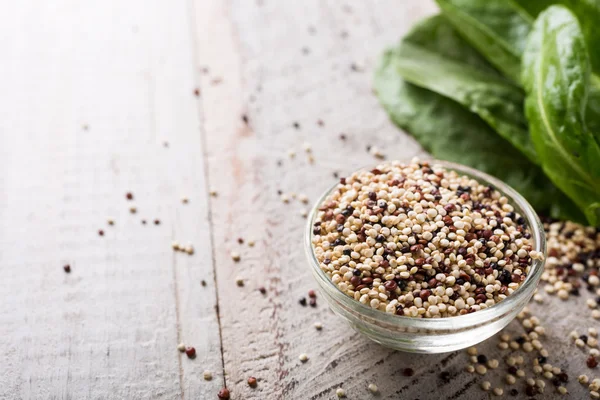 Pile of mixed raw quinoa — Stock Photo, Image