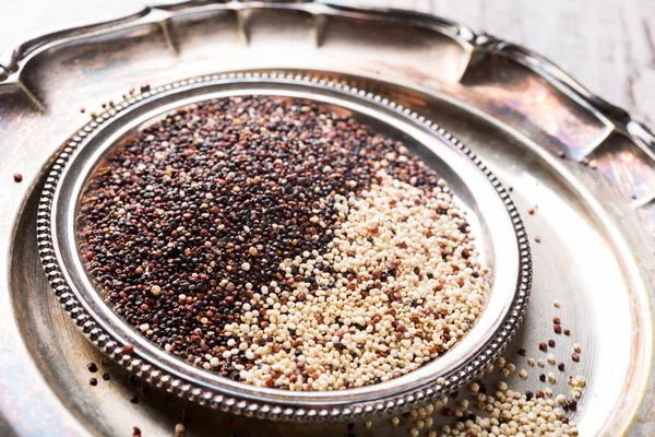 Pile of mixed raw quinoa — Stock Photo, Image