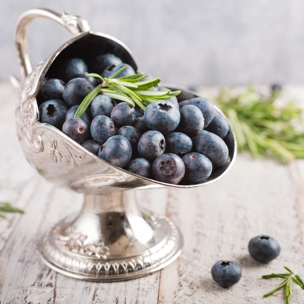 Fresh blueberries in vintage metal sugar bowl — Stock Photo, Image