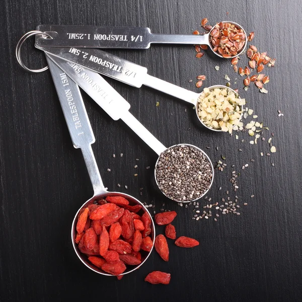 Superfoods in measuring spoons — Stock Photo, Image