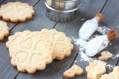 Homemade gluten free shortbread cookies with scoops of gluten free flour clipart