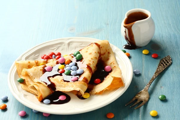 Homemade crepes with multicolored dragee — Stock Photo, Image