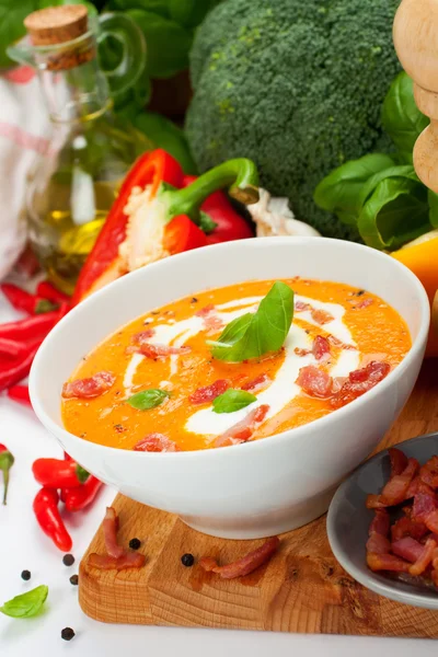 Carrot sweet pepper cream soup with bacon — Stock Photo, Image