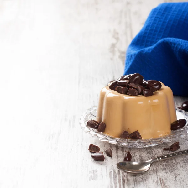 Coffee panna cotta with chocolate candies — Stock Photo, Image