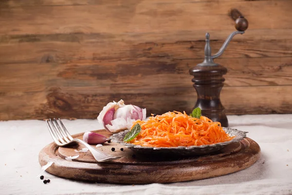 Spicy Korean style carrot salad on metal plate — Stock Photo, Image