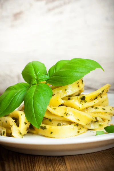 Cooked homemade pasta with pesto and basil — Stock Photo, Image