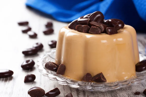 Coffee panna cotta with chocolate candies — Stock Photo, Image