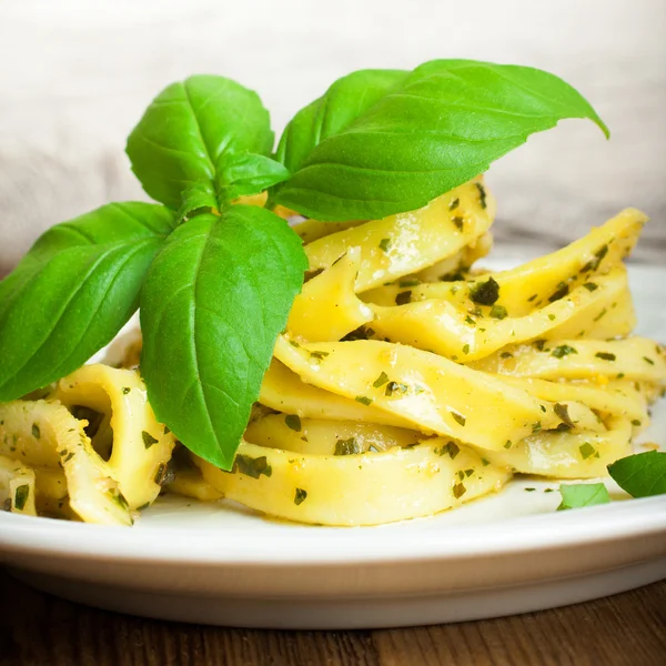 Cooked homemade pasta with pesto and basil — Stock Photo, Image