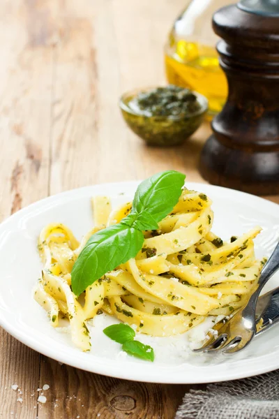 Cooked homemade pasta with pesto and basil — Stock Photo, Image