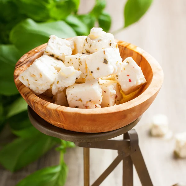 Cubed feta cheese on old scales — Stock Photo, Image
