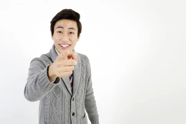 Asian young man pointing finger at you Stock Photo