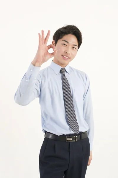 Asiático joven hombre de negocios dando bien signo — Foto de Stock
