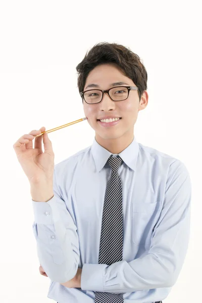 Asian male student with a pencil — Stock Photo, Image