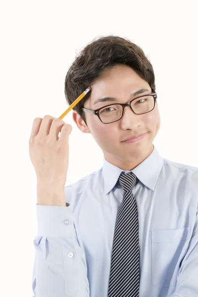 Asian male student with a pencil — Stock Photo, Image