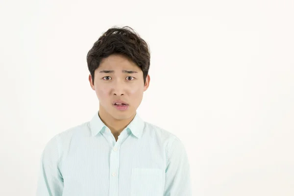 Rynkar pannan asiatisk manlig student — Stockfoto