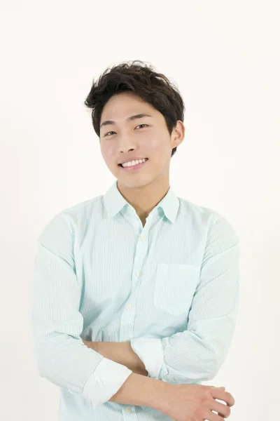 Asiático guapo macho estudiante con su brazos cruzados — Foto de Stock