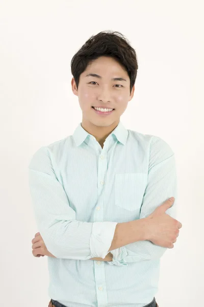 Asian handsome male student with his arms crossed — Stock Photo, Image