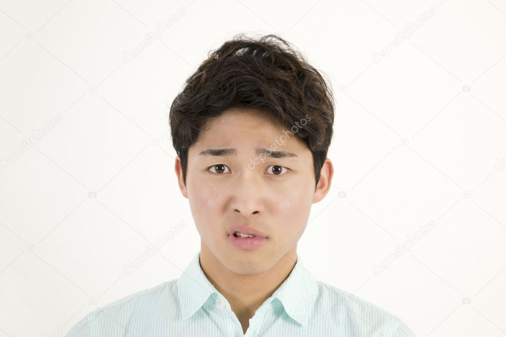 Frowning asian male student