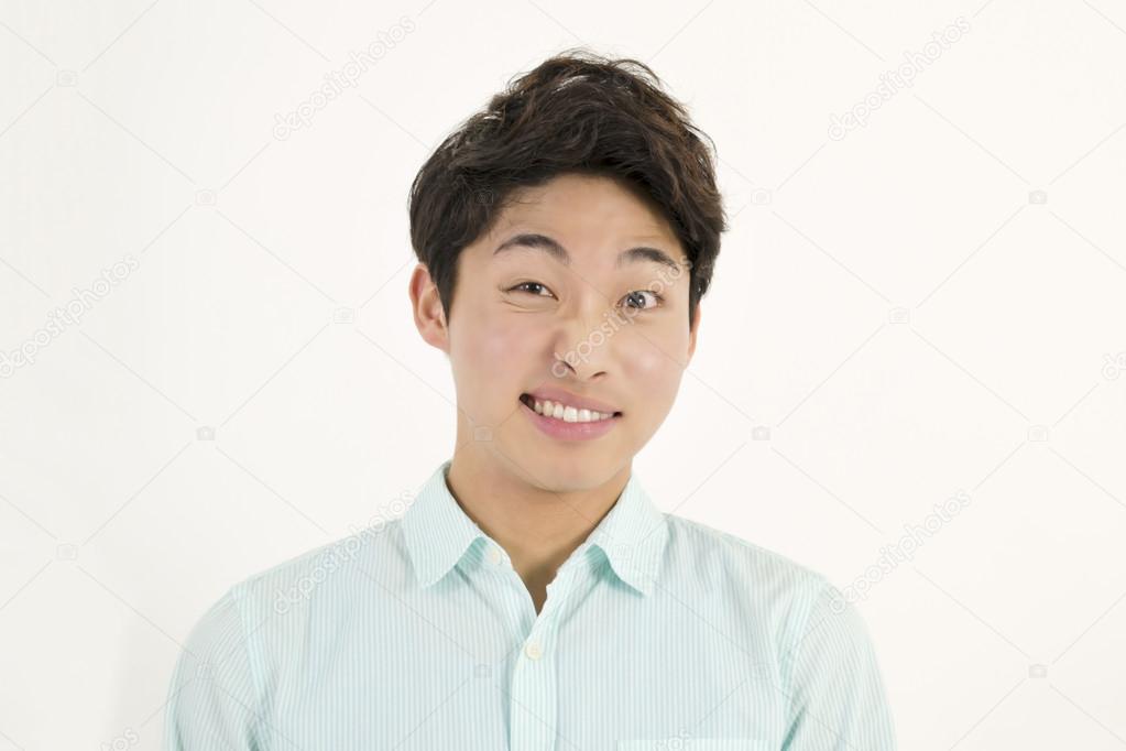 Frowning asian male student