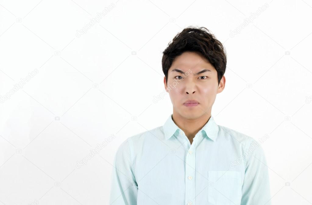 Frowning asian male student