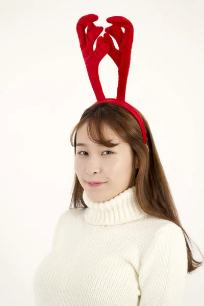 Young asian woman wearing Christmas antlers — Stock Photo, Image