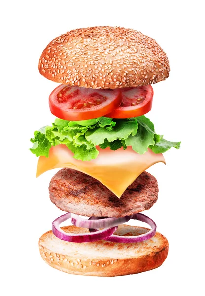 Latające burger składniki na białym tle — Zdjęcie stockowe