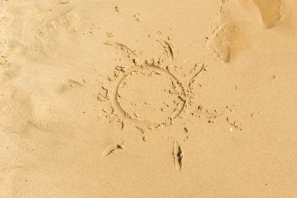 Sun sign on sand — Stock Photo, Image