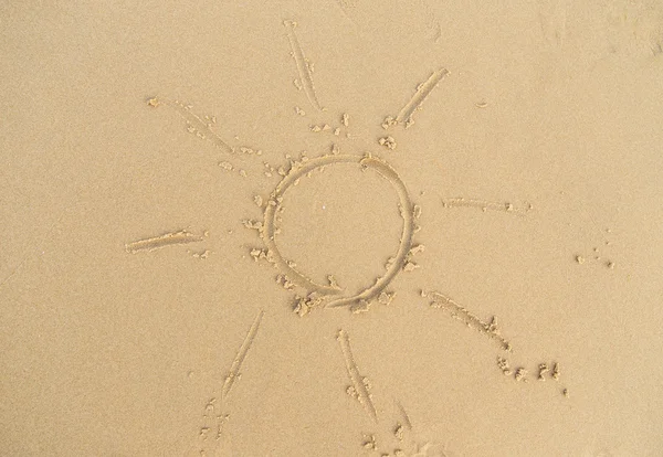 Sun sign on sand — Stock Photo, Image