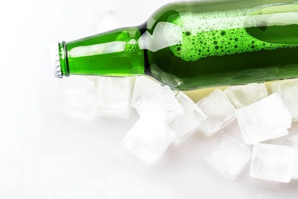 Beer bottle in ice cubes — Stock Photo, Image